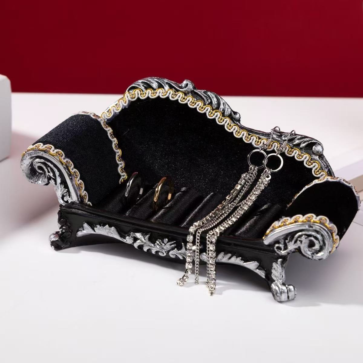 Luxurious black princess necklace display sofa