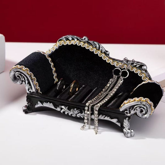 Luxurious black princess necklace display sofa